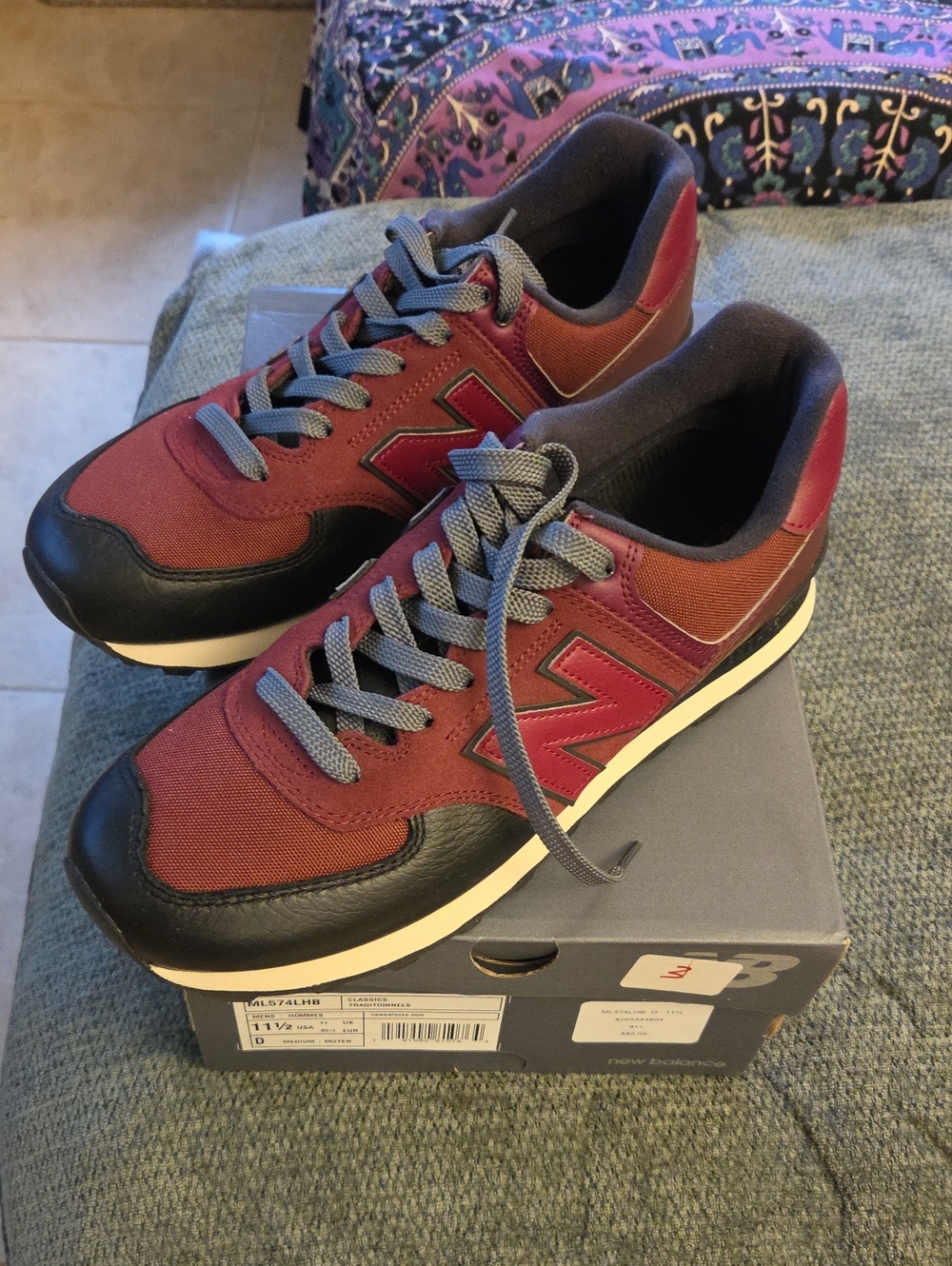New Balance 574 Men's Sneakers in Burgundy and Black with Gray Laces.
